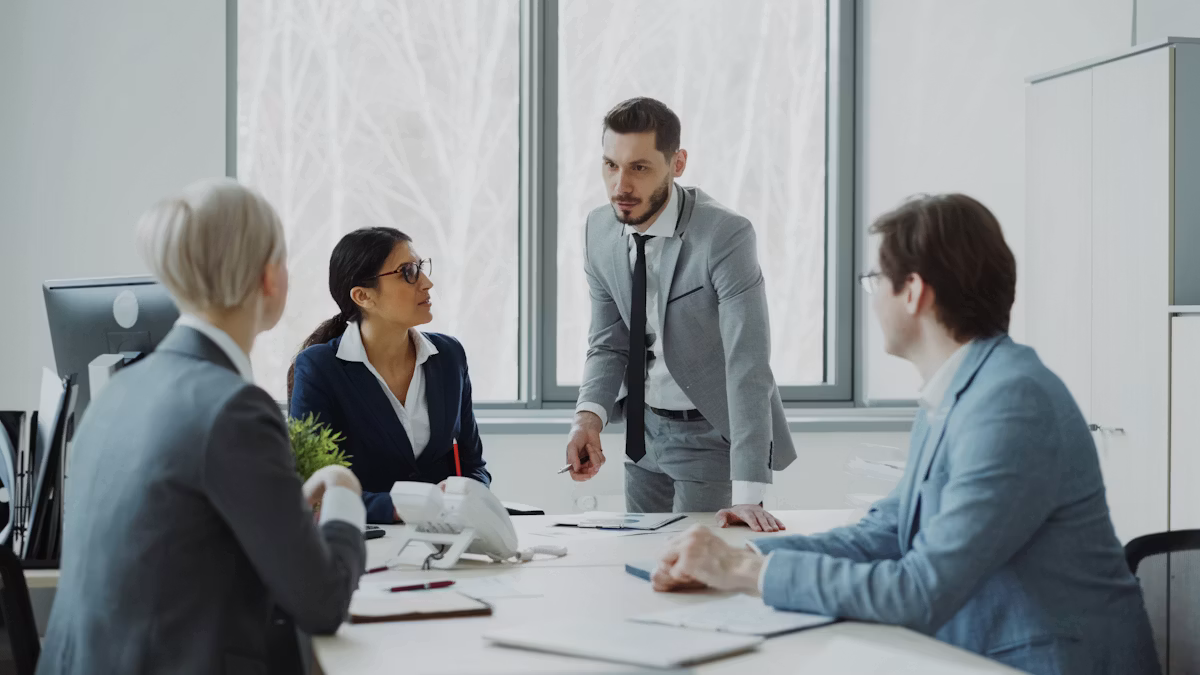 Business professionals reviewing financial reports around a table