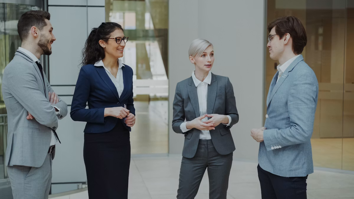 Business professionals discussing investment strategy in an office lobby